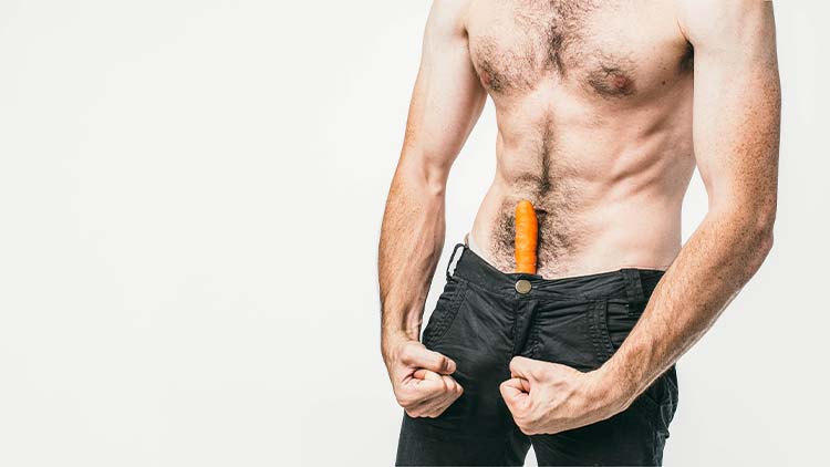 A picture of a man that has a carrot in his pants and showing that he is sexual and powerful. Also he has a good body. Cut view.