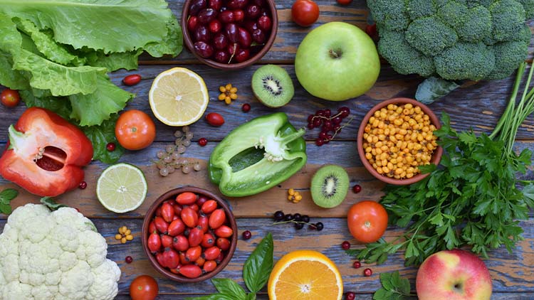 Composition of products containing ascorbic acid, vitamin C - citrus, cauliflower, broccoli, sweet pepper, kiwi, dog rose, tomatoes, apple, currant, sea buckthorn, dogwood. Top view. Flat lay.