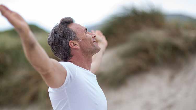 Mature man doing meditation