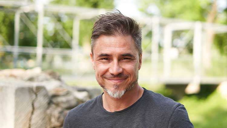 Outdoor portrait of happy older white man