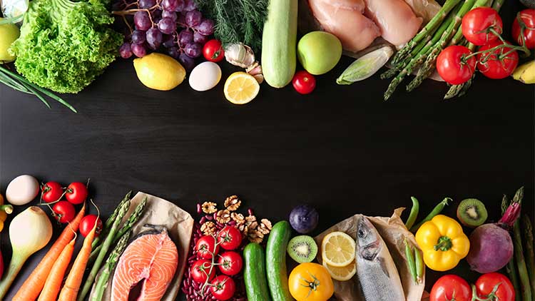 Various healthy products on dark background