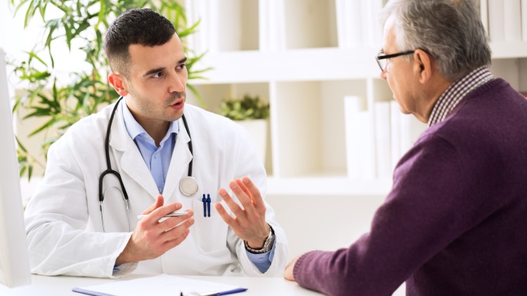 Doctor talking with patient