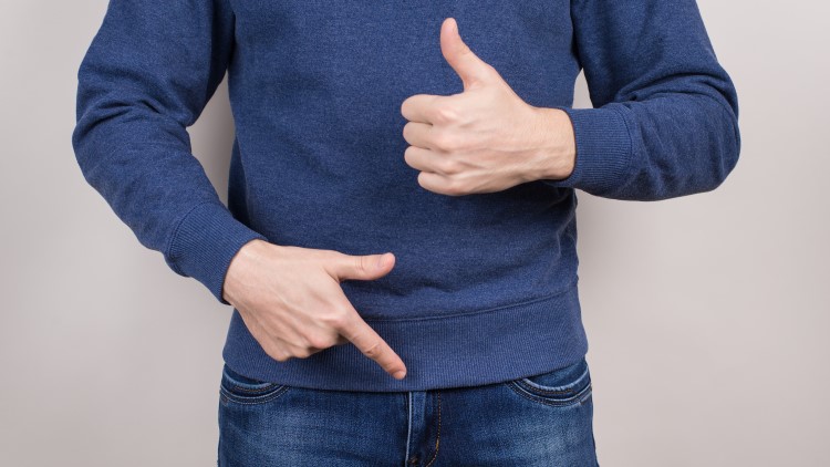 Man pointing at groin giving thumbs up