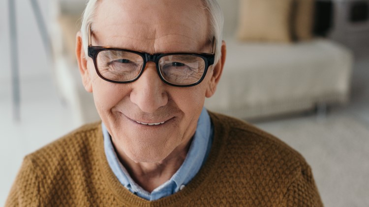 Senior smiling man wearing glasses